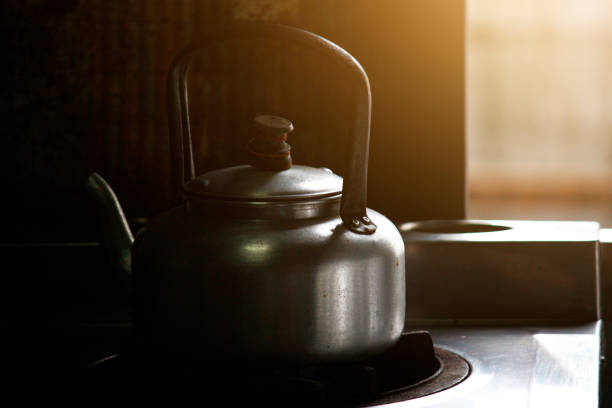 istock Vintage Teapot with sunlight on the window in local kitchen in Thailand 1140769093