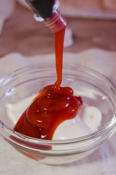 istock mixing mayonnaise with ketchup in glass bowl 1140771402
