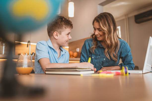 istock Photo of Speech therapist teaching a language an autistic child 1140773630