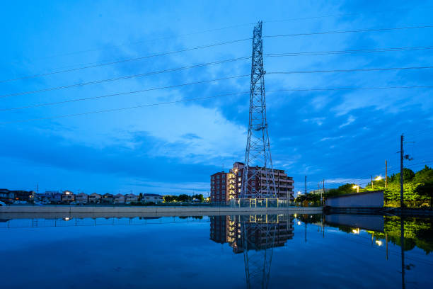 istock A pond at dawn where the steel towers are reflected 1140773857