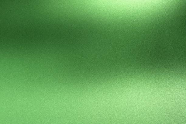istock Abstract texture background, light shining on rough green metal wall 1140774054