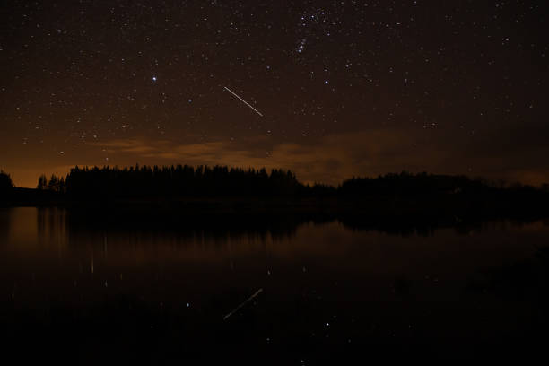 istock Night sky with starts in a  Conemara lake with Pine Forest around 1140775988
