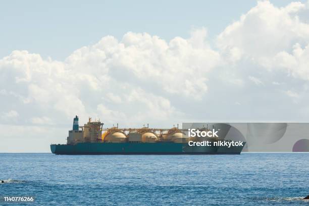 Liquefied Natural Gas Lng Transportation Tanker Ship Blue Sea And Sunny Sky Background Stock Photo - Download Image Now