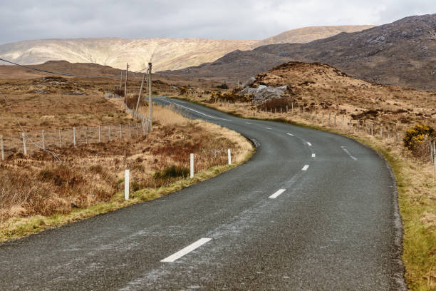 istock Conemara road and bog with mountains in background 1140778213