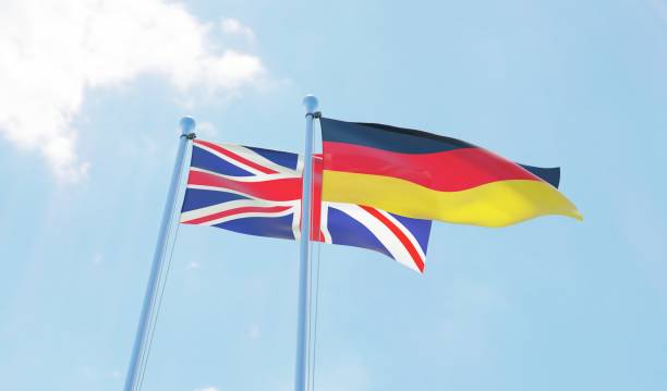 istock UK and Germany, two flags waving against blue sky 1140779100