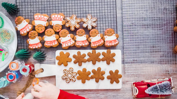 istock Decorating gingerbread cookies with royal icing 1140779625