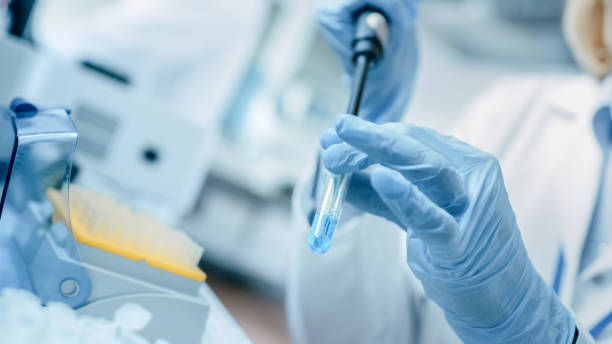 istock Close-up of the Hand in Glove Using Micro Pipette while Working with Test Tubes. People in Innovative Pharmaceutical Laboratory with Modern Medical Equipment for Genetics Research. 1140779723