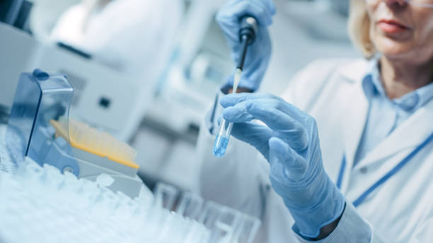 istock Close-up of the Hand in Glove Using Micro Pipette while Working with Test Tubes. People in Innovative Pharmaceutical Laboratory with Modern Medical Equipment for Genetics Research. 1140779728