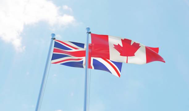 istock UK and Canada, two flags waving against blue sky 1140779844