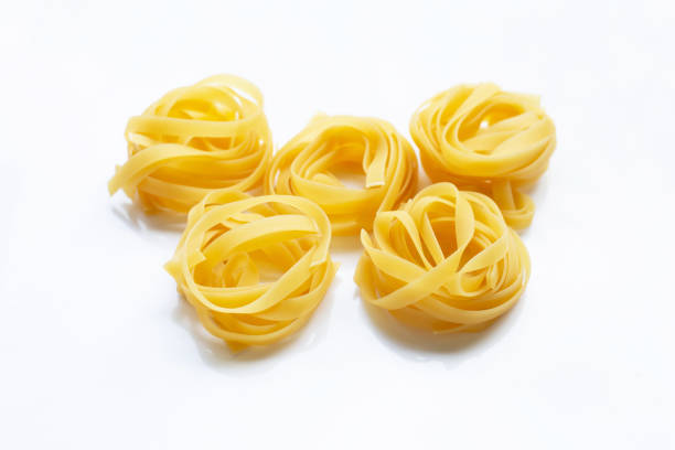 istock Italian pasta tagliatelle nest on white 1140780185