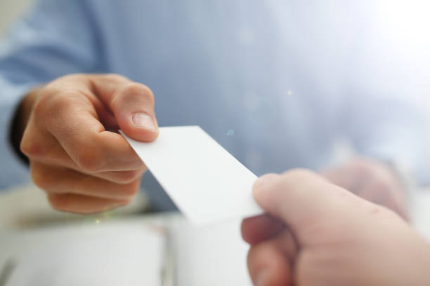 istock Male hand in suit give blank calling card 1140781481