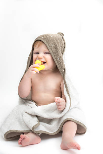 istock Baby bath with yellow duck in towel 1140781564