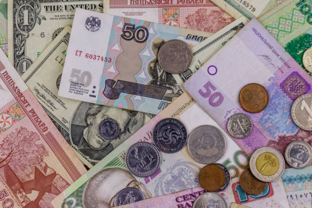 istock Background of banknotes and coins from different countries 1140781801