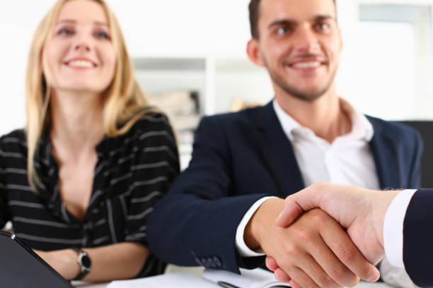 istock Man in suit shake hand as hello in office closeup 1140782072