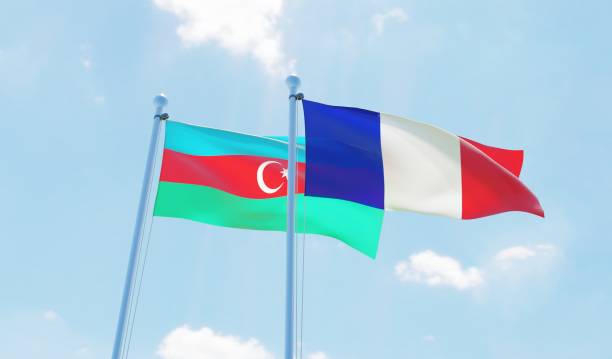 istock France and Azerbaijan, two flags waving against blue sky 1140784513