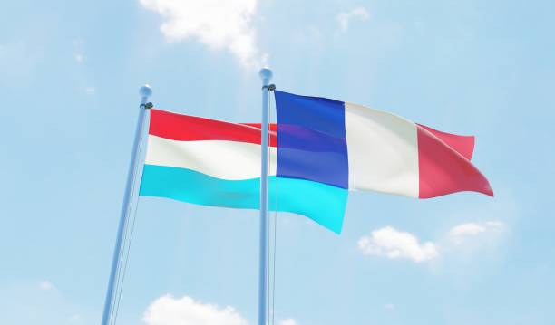 istock France and Luxembourg, two flags waving against blue sky 1140785302