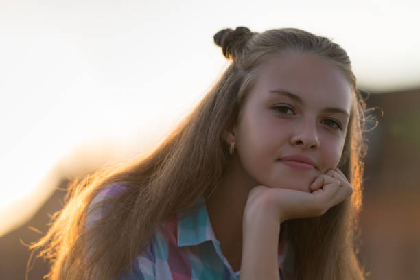 istock Thoughtful young girl staring at the camera 1140788727