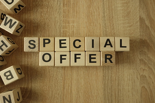 Special offer text from wooden blocks on desk