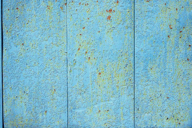istock Texture of old rusty metal, painted blue with peeling paint and with red layer under it. Horizontal texture of cracked paint on rusty steel 1140791431