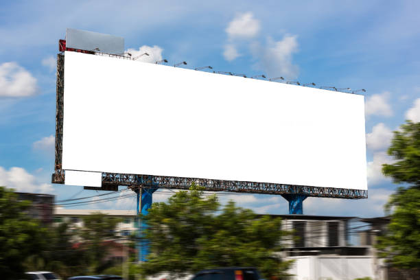 istock Blank white billboard under blue sky - can advertisement for display or montage input the free space of product and business. 1140792584
