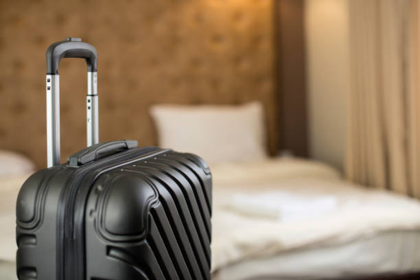 istock Suitcase in a hotel room 1140792660