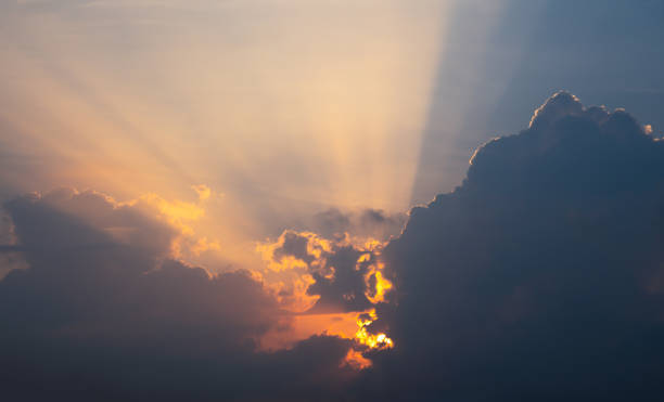 istock Sun beam behind the clouds on blue sky 1140795165