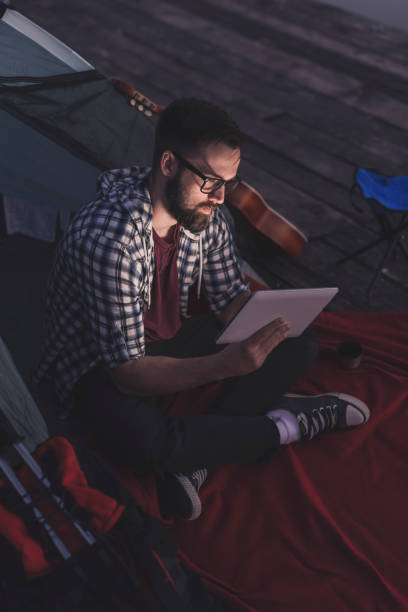 istock Digital nomad camping on the lake 1140795327