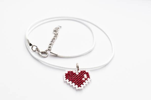 istock Handmade Cross Stitch Necklace Red Heart 1140796736