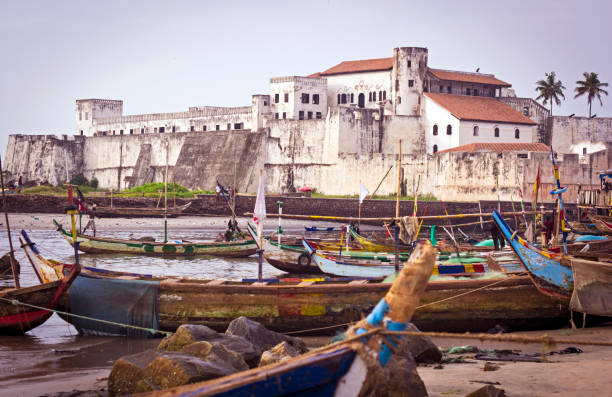 Ghana coast Fishing boats and Elmina Castle, Ghana ghana photos stock pictures, royalty-free photos & images