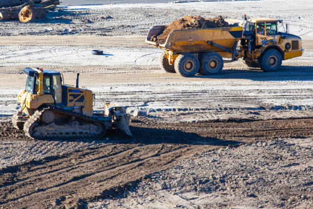 istock bulldozer and big truck at a construction site 1140797055