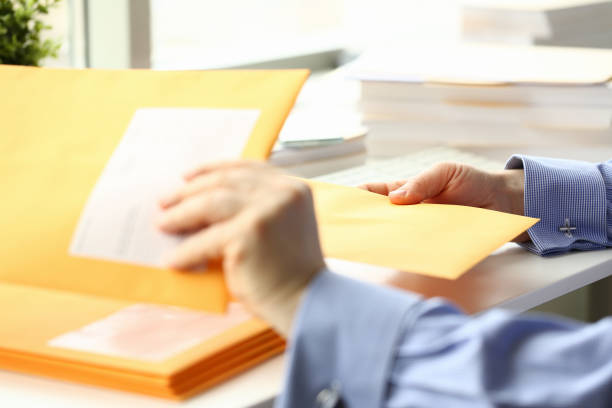 istock Businessman hold hand yellow mail envelope 1140797176