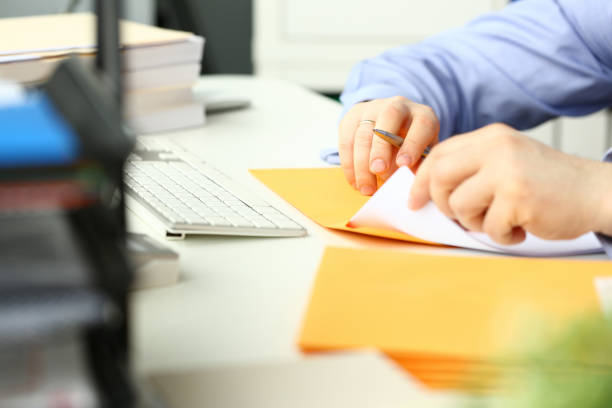 istock Businessman hold hand yellow mail envelope 1140797180