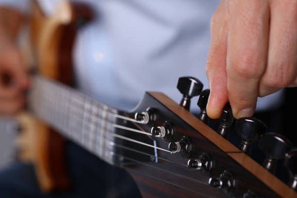 istock Male arms playing classic shape electric guitar 1140798307