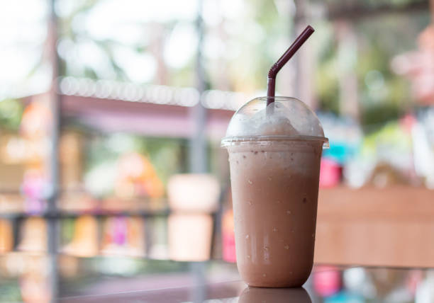 Iced chocolate, Summer refreshment drinks on wooden background in cafe.