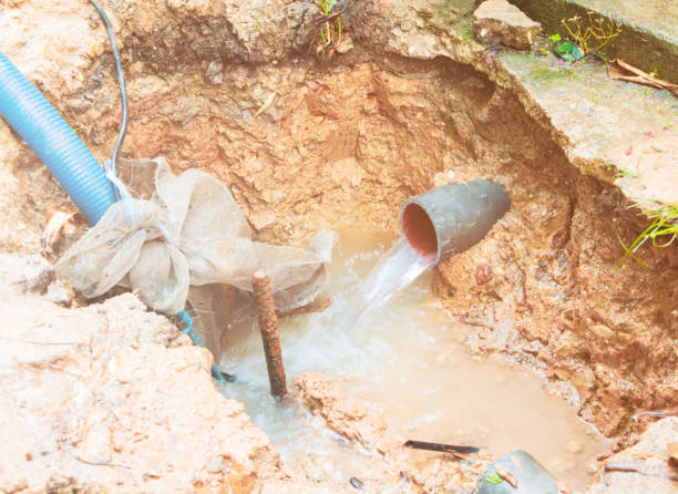 istock broken pipe in hole with water motion at roadside wait repair 1140799441