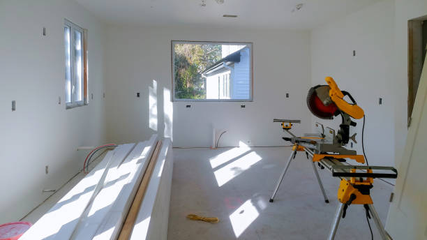 istock Construction remodeling home cutting wooden trim board on with circular saw. 1140800913