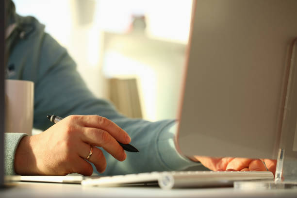 istock A young designer holds a pen from a tablet in his 1140800936