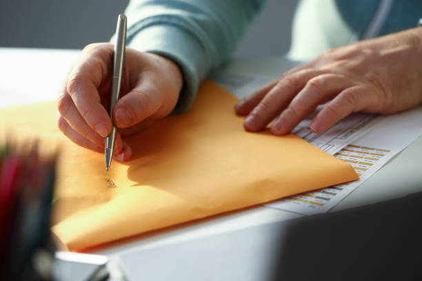 istock Male hand holding silver pen 1140800940