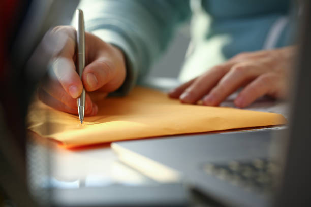 istock Male hand holding silver pen 1140800941