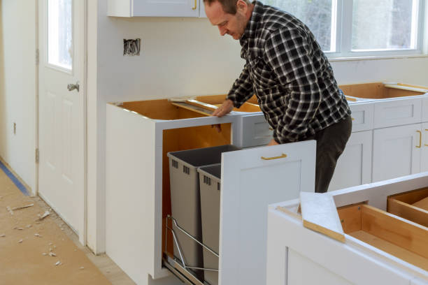 istock Handyman in installed drawers garbage bin in the kitchen 1140802086