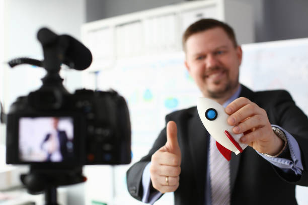 istock Businessman hold rocket in hand closeup 1140802294