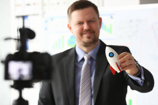 istock Businessman hold rocket in hand closeup 1140802303