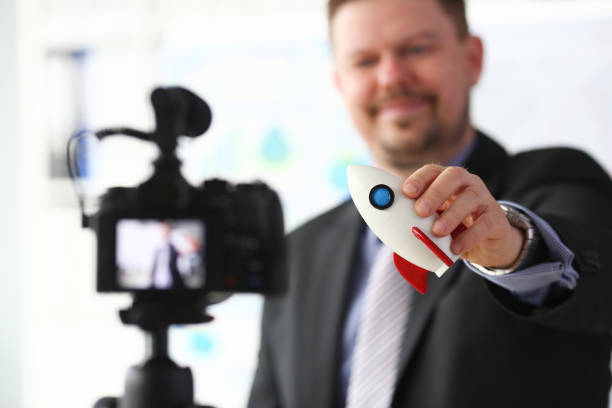istock Businessman hold rocket in hand closeup 1140802308