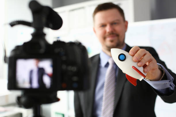 istock Businessman hold rocket in hand closeup 1140802309
