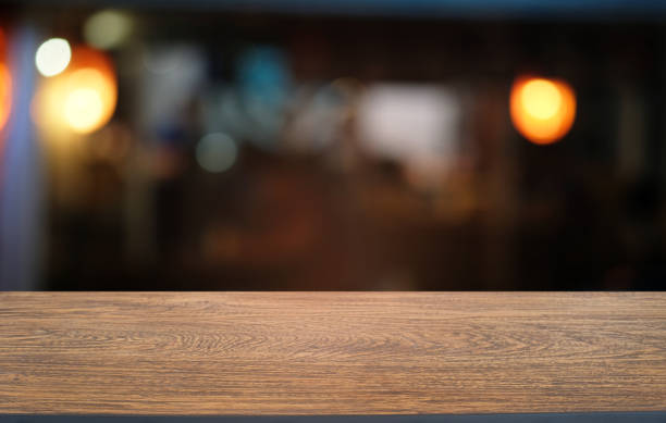 istock Empty dark wooden table in front of abstract blurred bokeh background of restaurant . can be used for display or montage your products.Mock up for space. 1140802446