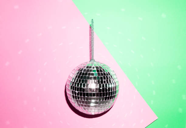 istock Shiny disco ball on a bright pastel creative background. Pop disco music style attributes eighties 1140806855