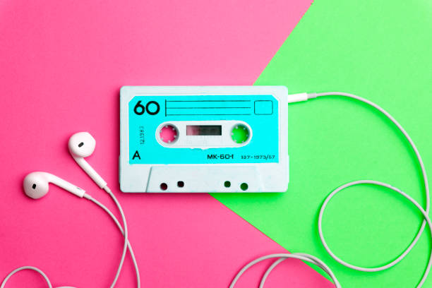 istock Retro old school 80-s or 90-s concept. Audio cassette on a bright blue-pink background 1140806856
