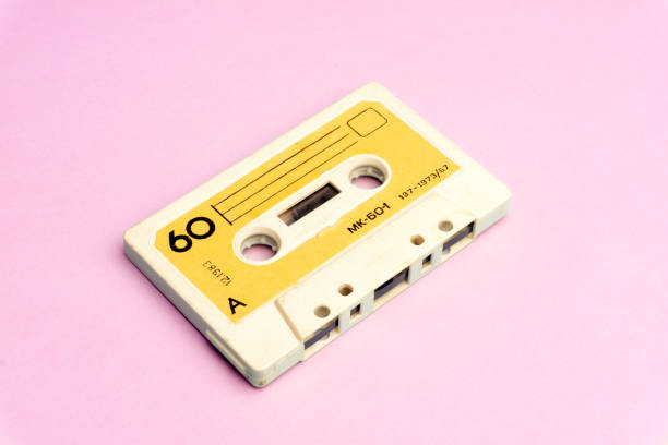 istock Retro old school 80-s or 90-s concept. Audio cassette on a bright blue-pink background 1140806859