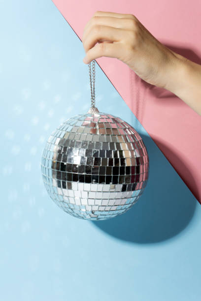 istock Shiny disco ball on a bright pastel creative background. Pop disco music style attributes eighties 1140806862