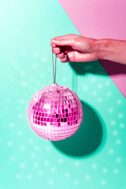 istock Shiny disco ball on a bright pastel creative background. Pop disco music style attributes eighties 1140806863